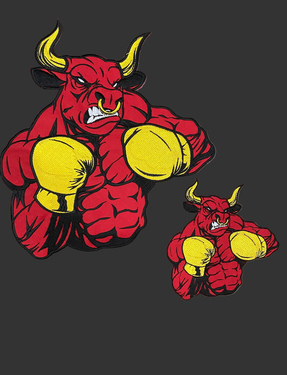 Red bull with yellow boxing gloves on a gray background