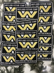 Multiple patches with Weyland-Yutani Corp logo and text on a textured background