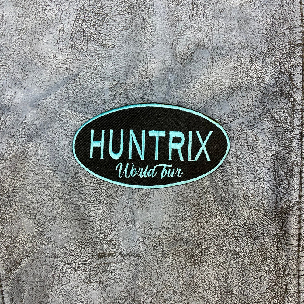 HUNTRIX logo on a textured surface