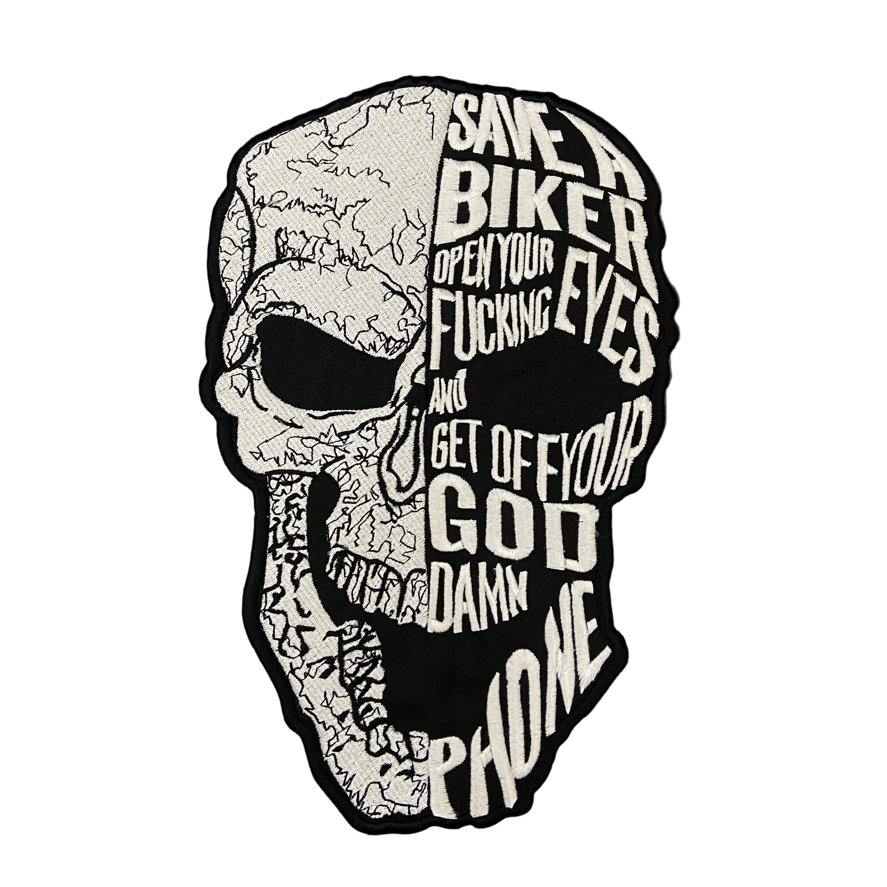 Skull-shaped sticker with text on a dark background
