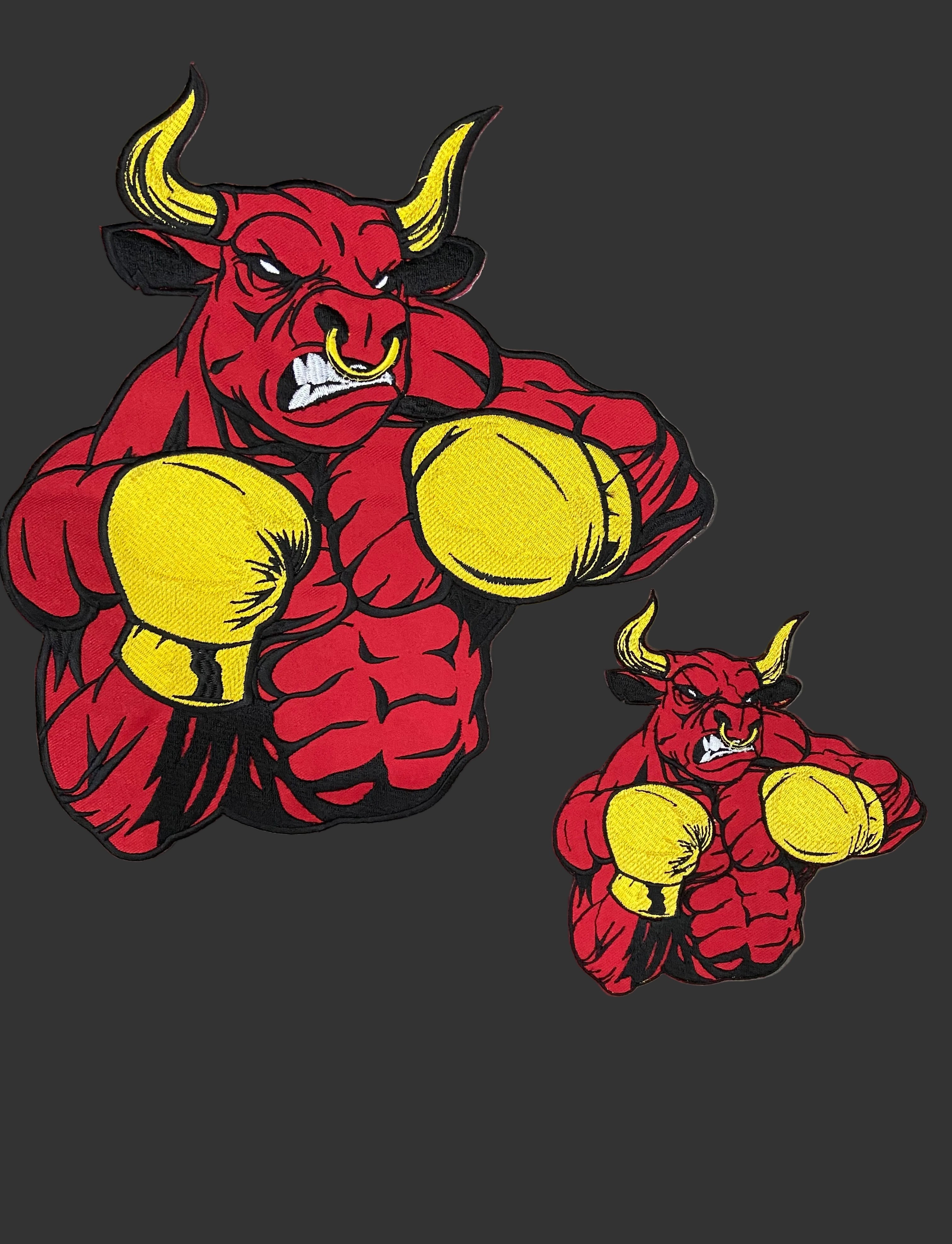 Red bull with yellow boxing gloves on a gray background