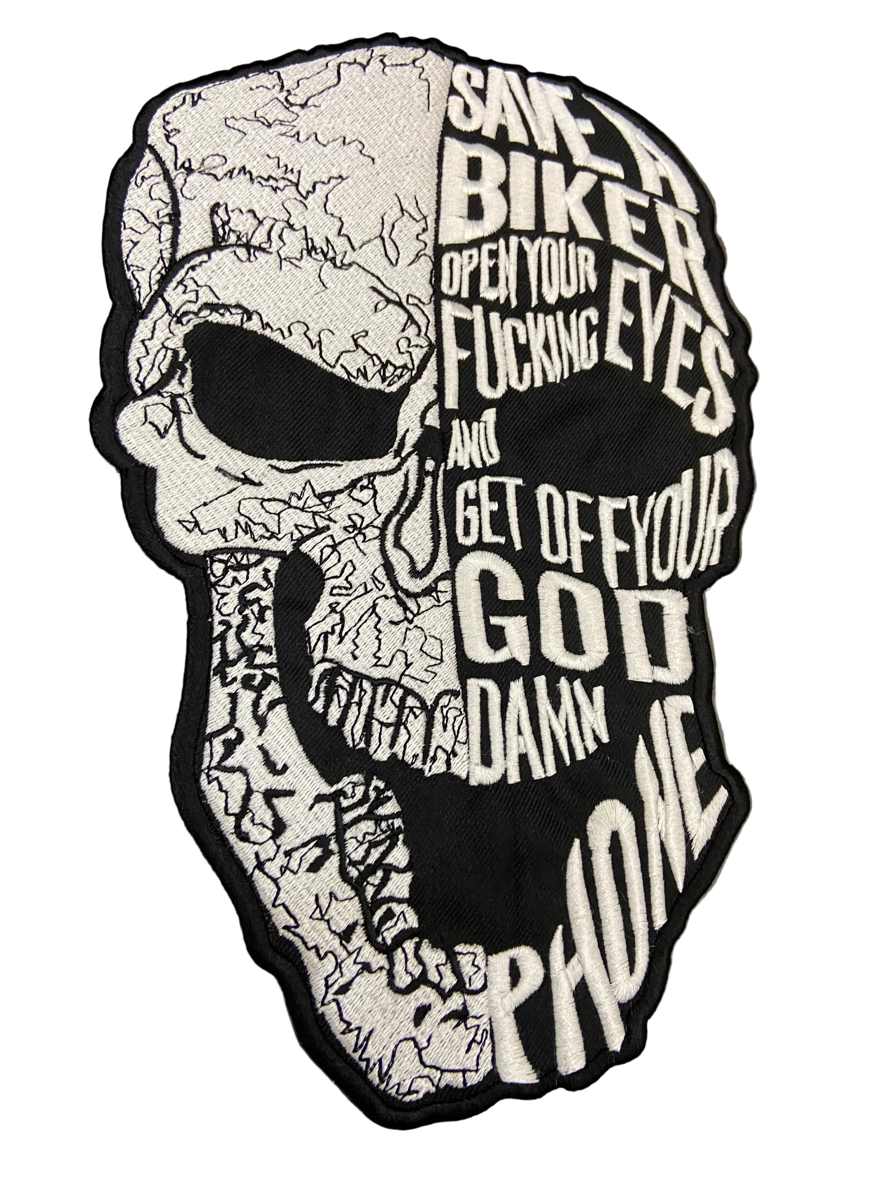 Skull-shaped patch with text on a gray background 