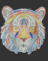 Decorative patch with colorful geometric design on a dark background